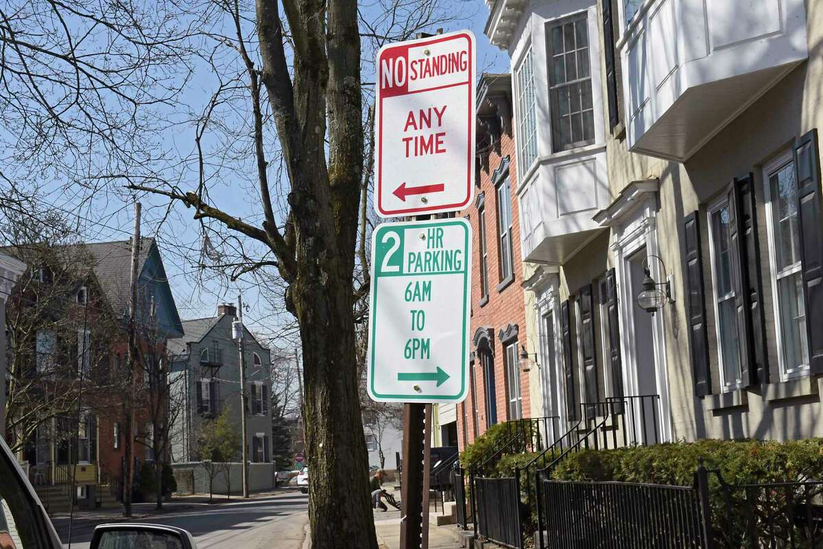 Parking signs are posted along a street in the Stockade neighborhood on Tuesday, March 23, 2021 in Schenectady N.Y. (Lori Van Buren/Times Union)