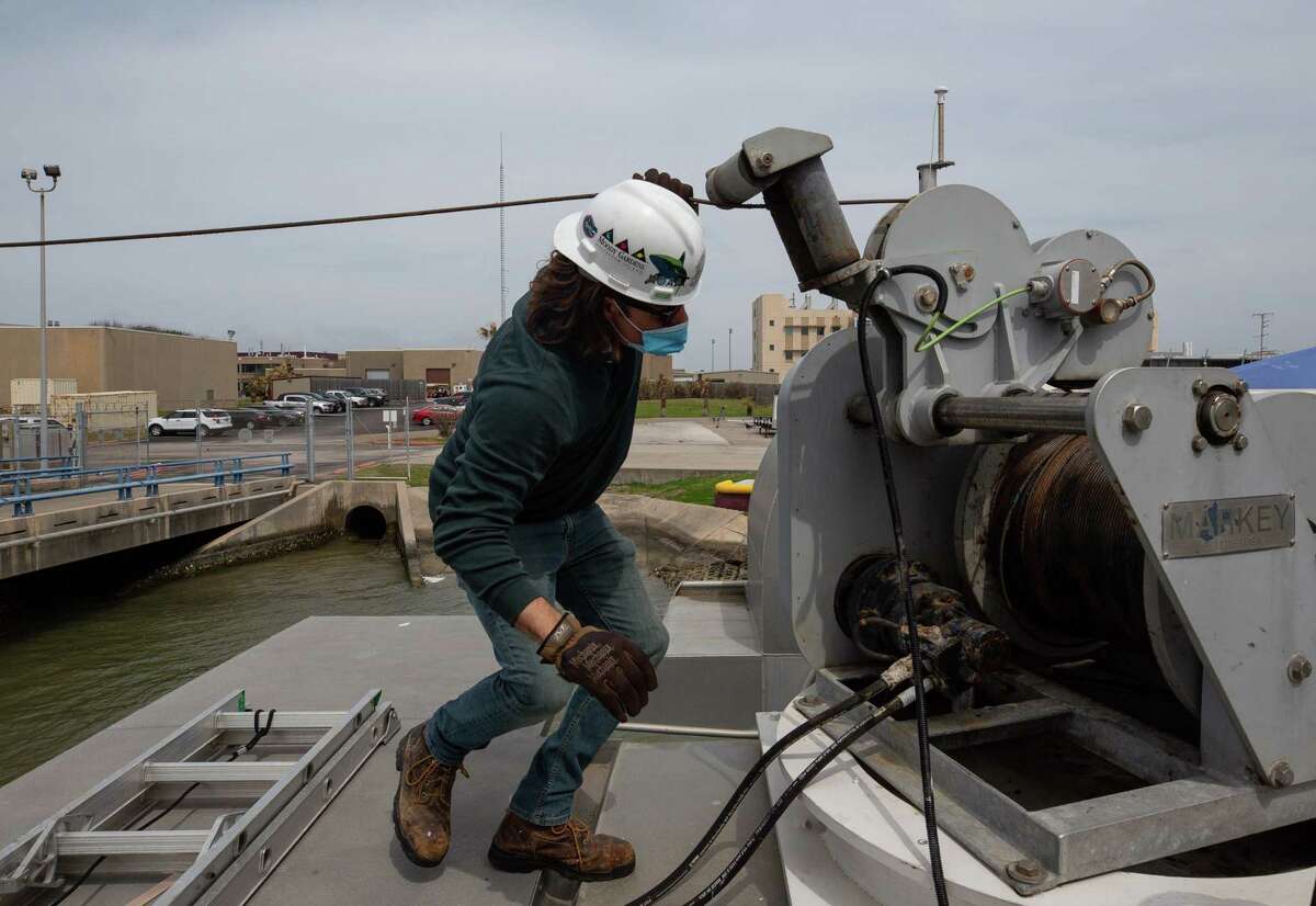 Justin Blake, Capt. of Research Vessel Manta, works to feed a science winch cable through a pulley that's part of the boat; which helps maintain the Flower Garden Banks National Sanctuary, on Thursday, March 11, 2021, in Galveston, Texas. The sanctuary is an underwater national park that protects some coral right now. New protections for coral reefs in the Gulf Coast are expected to take effect in the next few weeks.