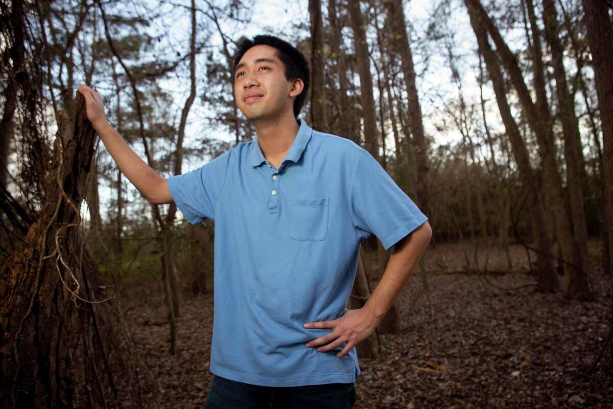 University of Texas student Francis King poses for a portrait at Kickerillo-Mischer Preserve Friday, March 12, 2021 in Houston. King is in his first year at UT Austin, but because of COVID-19 has been stuck studying at home. When he finished his finals before Christmas break, he developed a terrible headache and called 911, a CT scan revealed that his brain was hemorrhaging and he was life flighted to Memorial Hermann for a life-threatening condition. By the time he arrived, he had already slipped into a coma. A couple of surgeries later, King has now recovered and is back to school work.