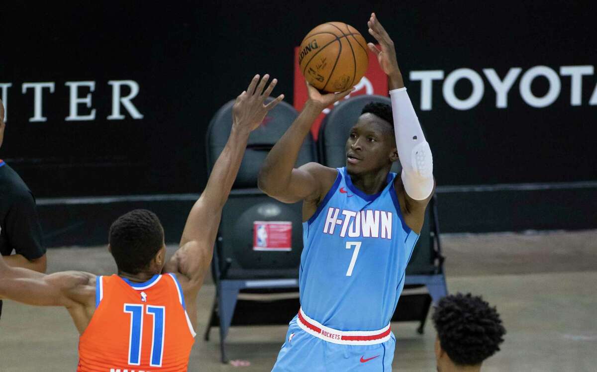 Houston Rockets guard Victor Oladipo (7) shoots a three point shot over Oklahoma City Thunder guard Theo Maledon (11) during the fourth quarter of an NBA game between the Houston Rockets and Oklahoma City Thunder on Sunday, March 21, 2021, at Toyota Center in Houston, TX.
