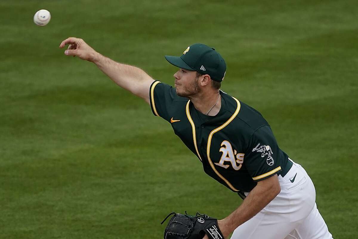 Oakland Athletics pitcher Daulton Jefferies throws against the Colorado Rockies during the second inning of a March 23 spring training game in Mesa, Ariz.