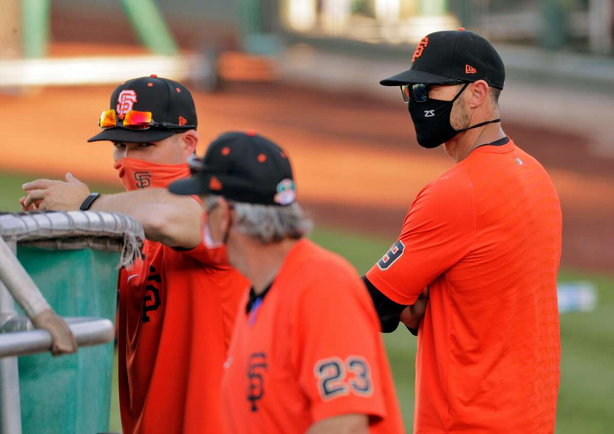 Giants manager Gabe Kapler (19) with Ron Wotus (23) and Dustin Lind (88) as the San Francisco Giants worked out at Scottsdale Stadium in Scottsdale, Ariz., on Tuesday, March 2, 2021.