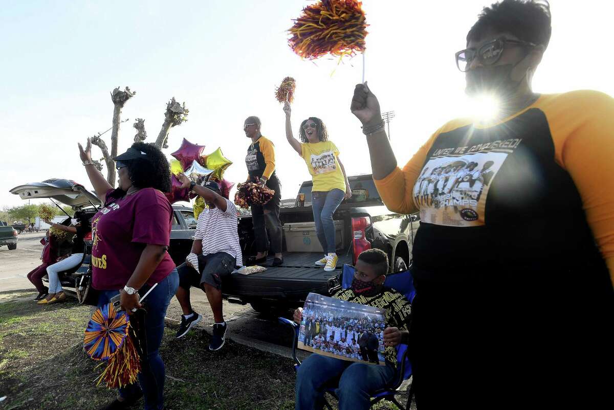 Terrance Arceneaux's family gather at the parade start as the community celebrated Beaumont United boys basketball's state championship victory Tuesday with a parade and pep rally at BISD Memorial Stadium. Photo made Tuesday, March 23, 2021 Kim Brent/The Enterprise