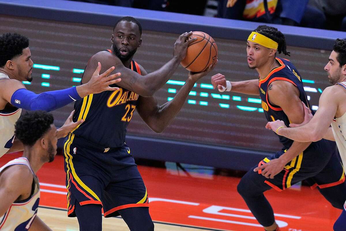 Draymond Green (23) looks to pass in the first half as the Golden State Warriors played the Philadelphia 76ers at Chase Center in San Francisco, Calif., on Tuesday, March 23, 2021.