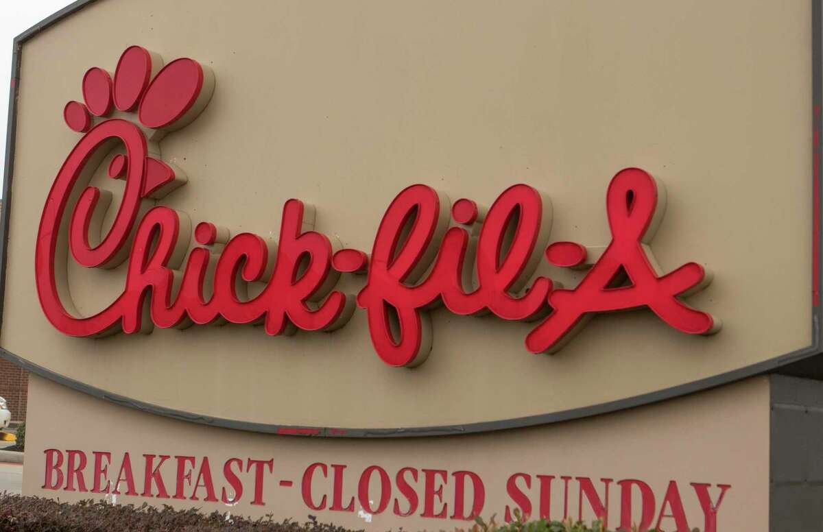 The Chick-fil-A sign near the front entrance of a restaurant at 1321 W. Davis St. in Conroe.