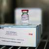 A vial on top of a box of Covid-19 vaccine, manufactured by Moderna Inc., in cold storage at the Covid-19 vaccination center inside France's national velodrome in the Saint-Quentin-en-Yvelines district of Paris, France, on Wednesday, March 24, 2021. The French government aims to have immunized 10 million people by mid-April, 20 million in mid-May and 30 million mid-June -- slightly less than half of the total population. Photographer: Nathan Laine/Bloomberg