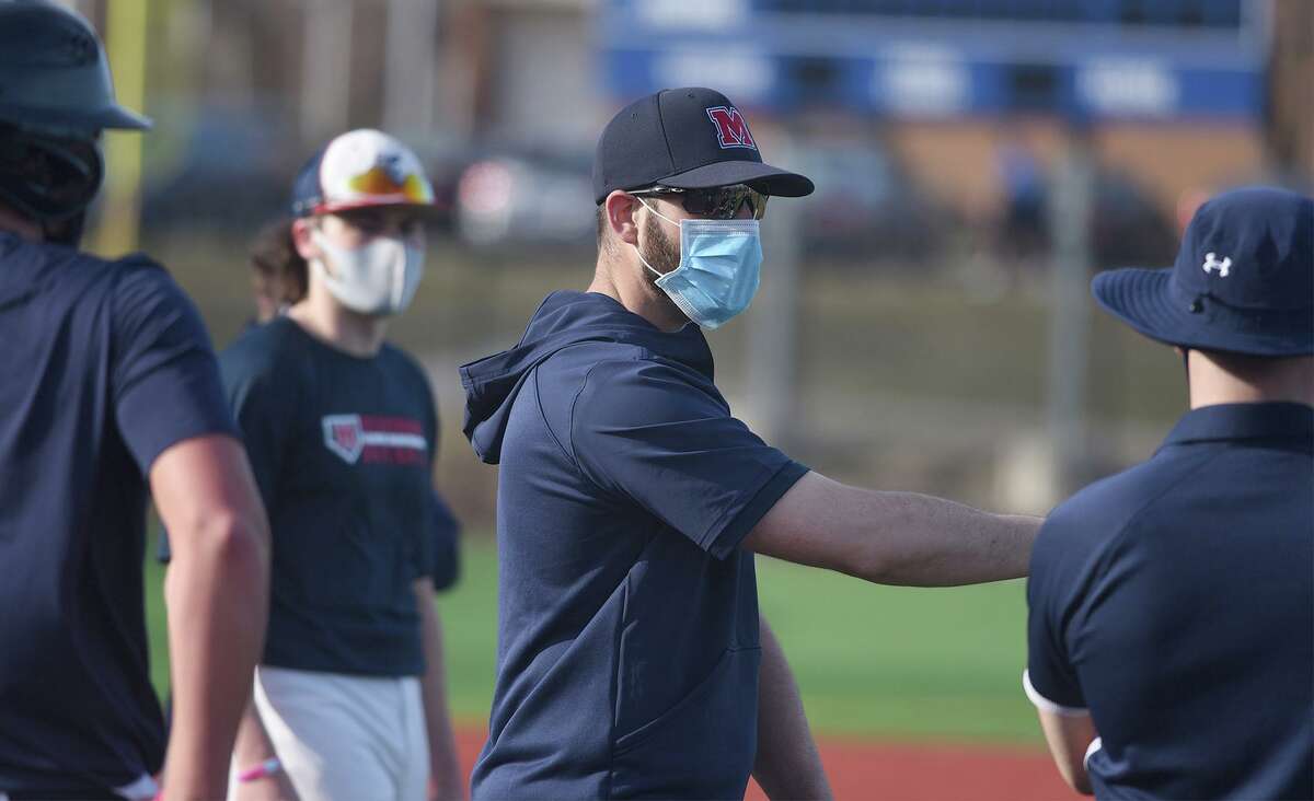 Brien McMahon baseball coach Steve Buckett talks to his players during the first week of pitchers and catchers for the preseason at BMHS on Tuesday, March 23, 2021.