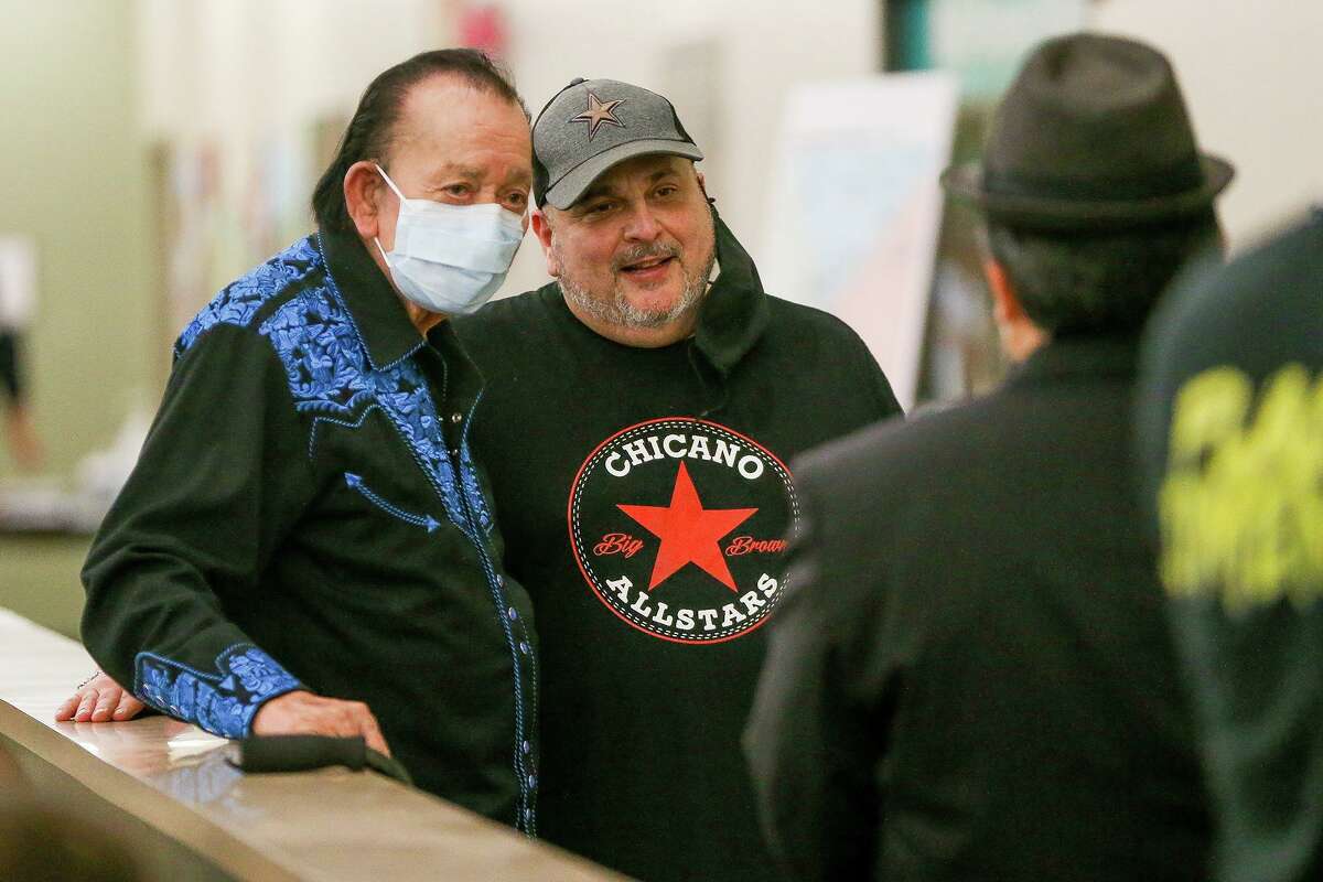 Flaco Jimenez, left, and Max Baca with Los Texmaniacs take a break after performing for the people in the waiting room receiving vaccinations at at WellMed's Elvira Cisneros Senior Community Center at 517 SW Military Drive on Wednesday, March 24, 2021.