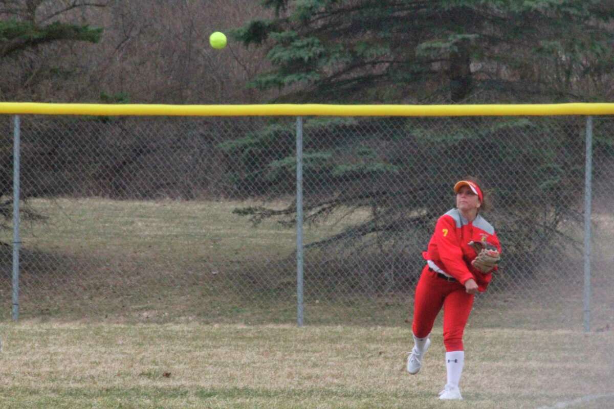 Ferris right fielder Kylie Winkels throws the ball in from the outfield during Wednesday's home GLIAC doubleheader. (Pioneer photo/John Raffel)