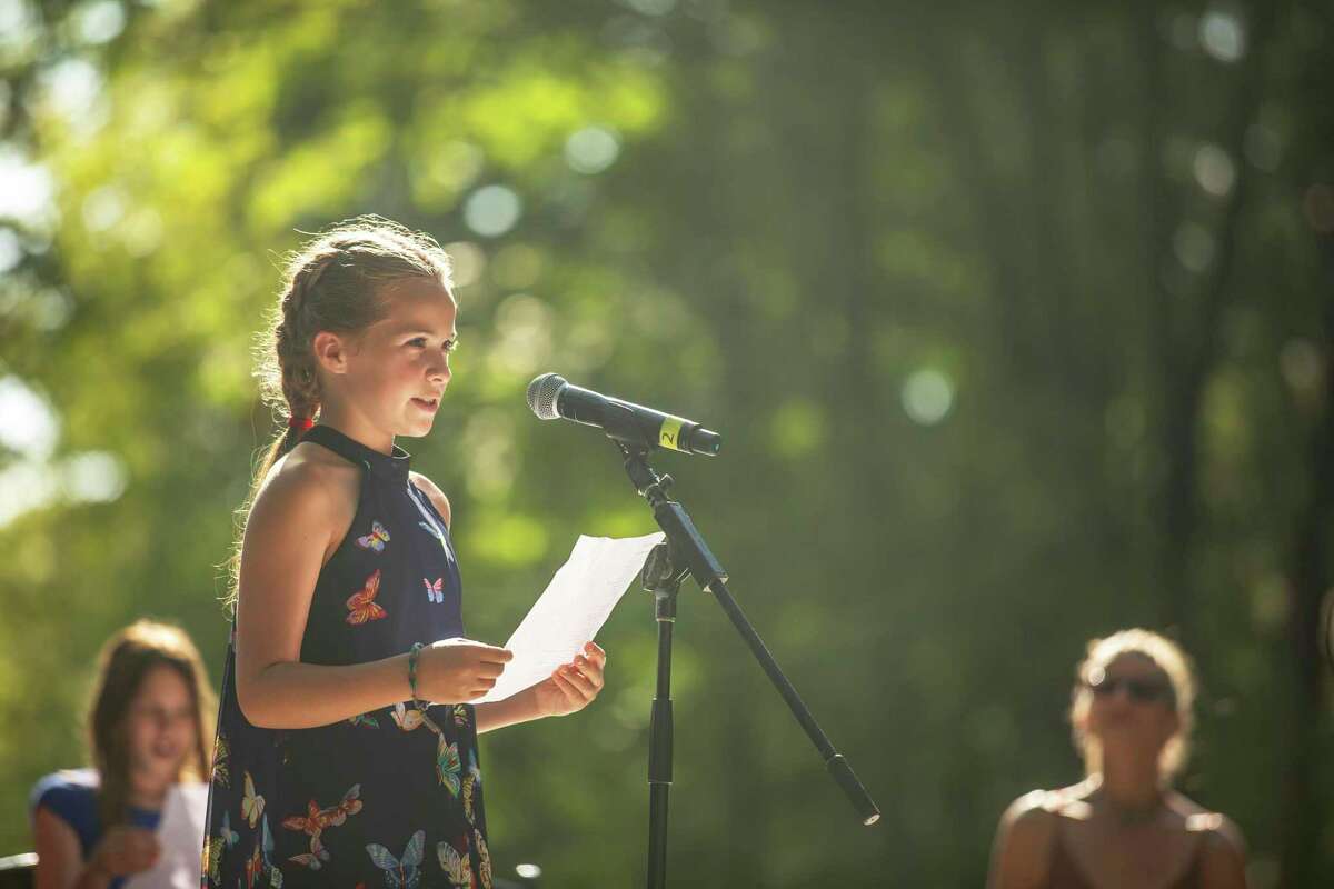 A top selected young writer performs her piece at 2019's Five Senses Festival in Washington.
