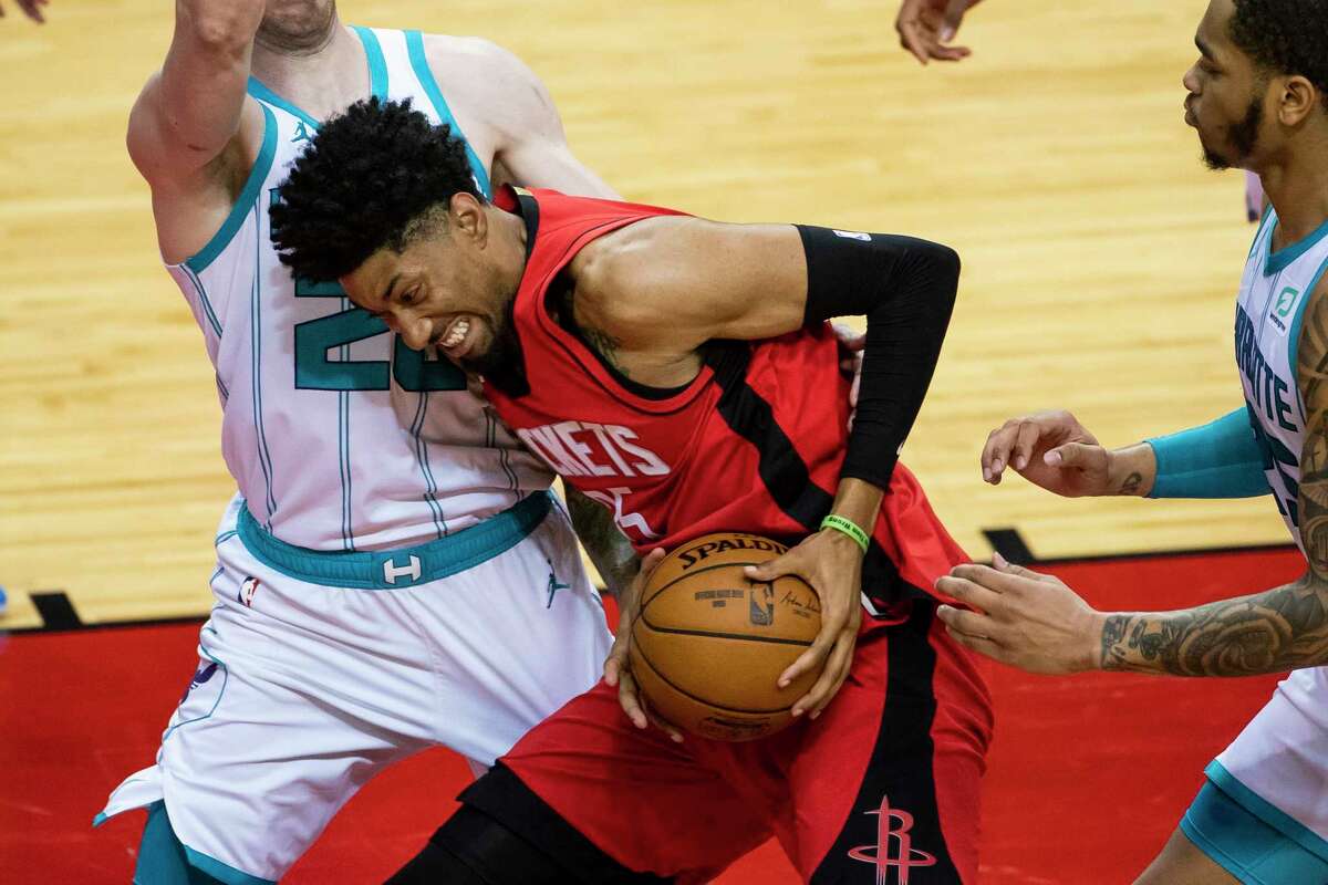 Houston Rockets center Christian Wood (35) drives into Charlotte Hornets forward Gordon Hayward (20) during the third quarter of an NBA game between the Houston Rockets and Charlotte Hornets on Wednesday, March 24, 2021, at Toyota Center in Houston.