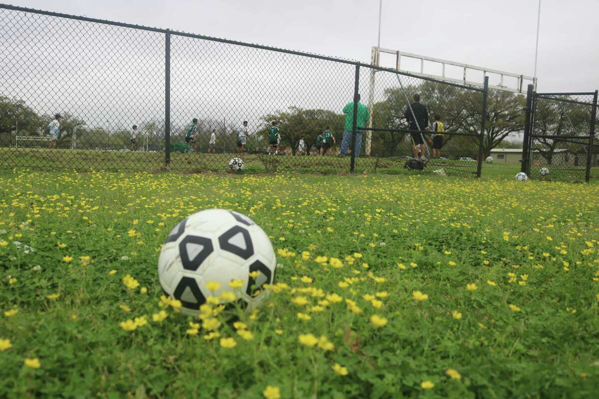 As the Eagle coaching staff watches workouts, a soccer ball rests in a bed of yellow flowers. Now the Eagles hope a bi-district title is about to bloom this weekend.