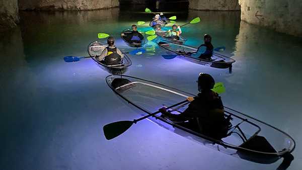 This tour takes you underground in a clear kayak