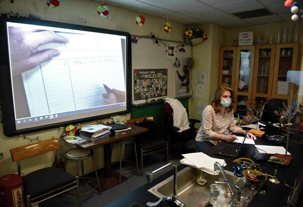 Science teacher Donna Kaiser teaches a class at Stamford High School in Stamford, Conn. Thursday, March 18, 2021. Kaiser was chosen as Stamford's Teacher of the Year and will be honored along with other finalists at the Excellence in Education Awards event on March 25.