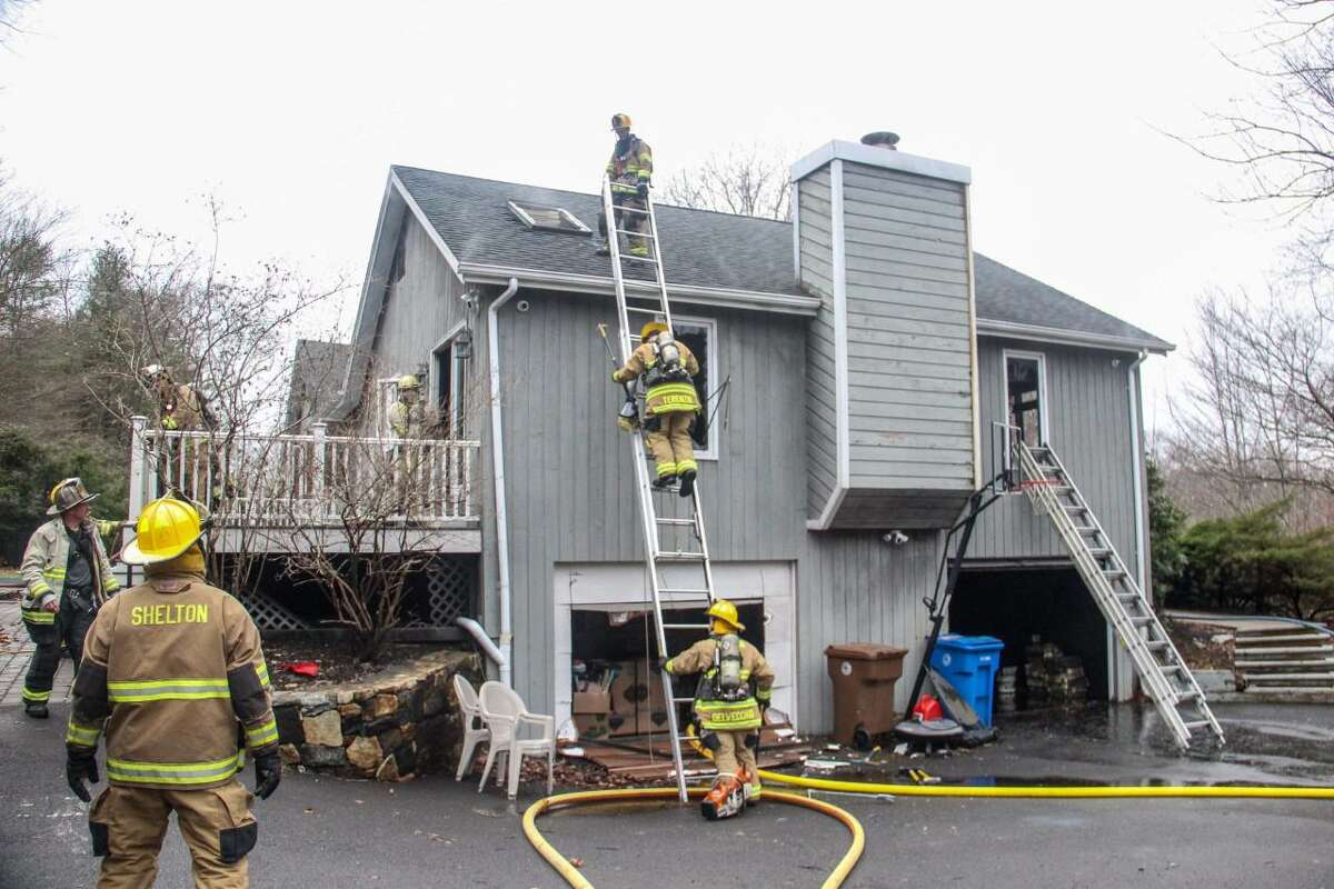 Shelton firefighters battled a blaze at a Mulberry Lane home on Thursday, March 25.