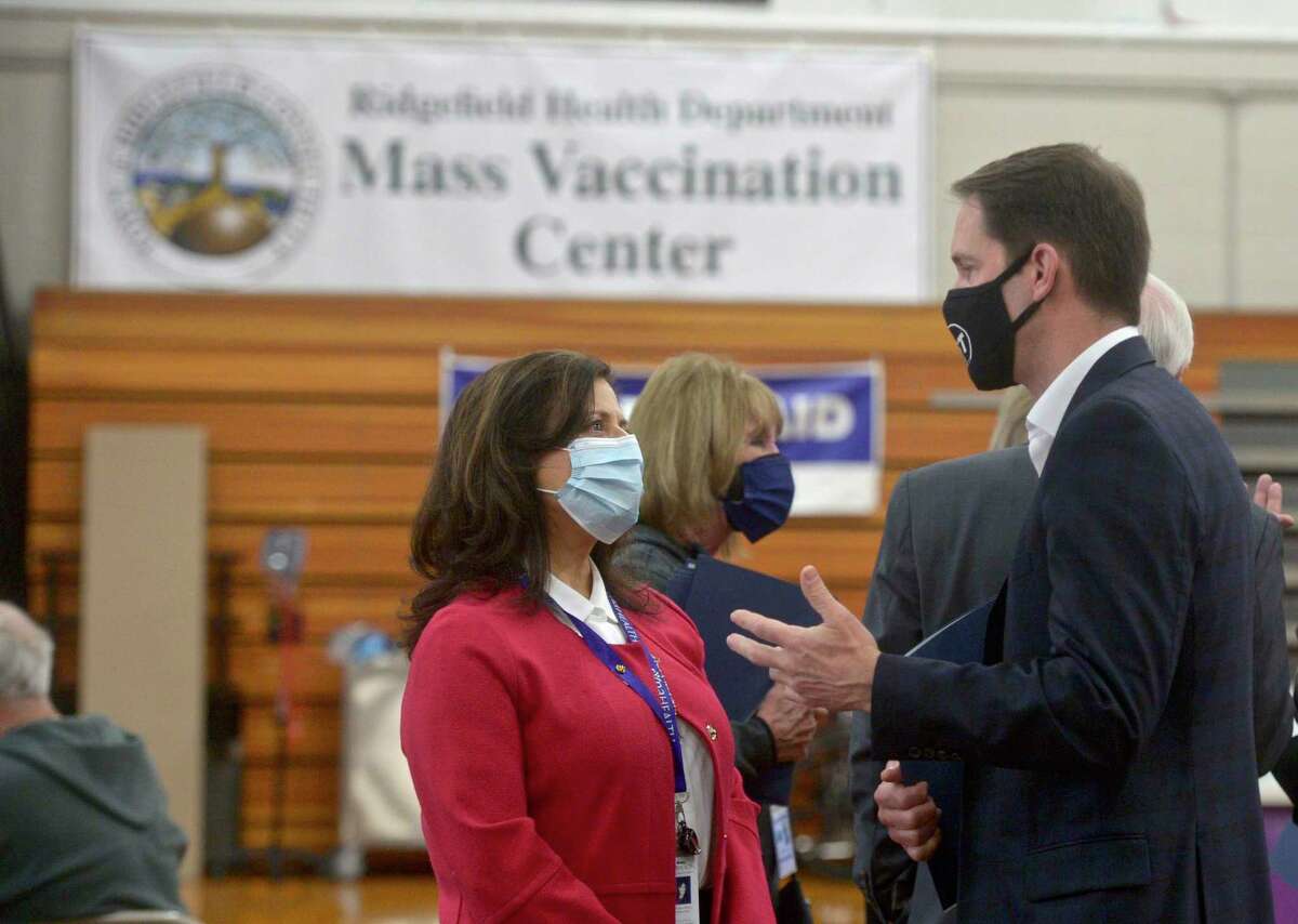 U.S. Representative Jim Himes, right, talks with Theresa Santoro, President and CEO of RVNA Health, during a visit to Ridgefield’s vaccination clinic on March 25.
