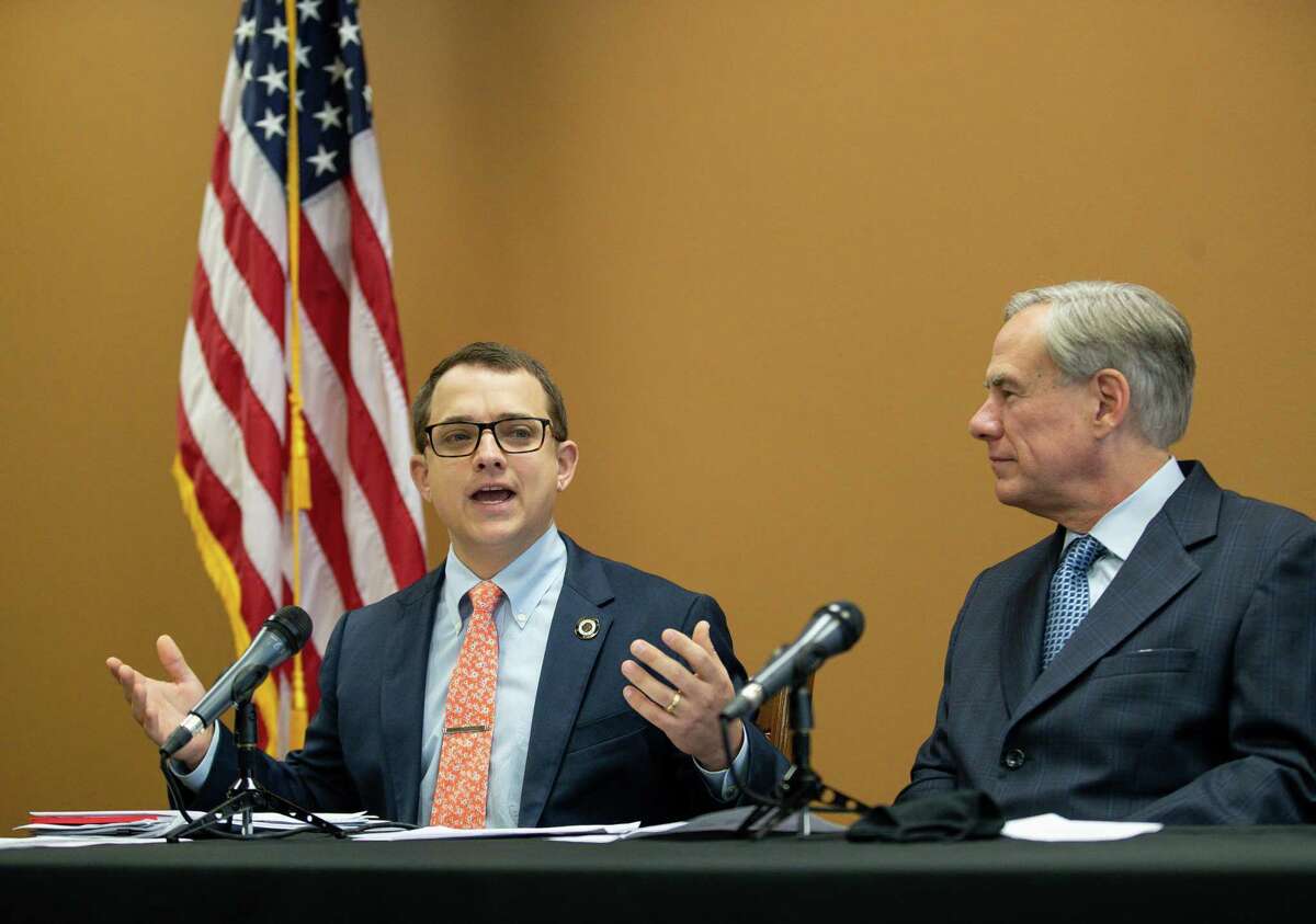 Representative Briscoe Cain, left, talks during a press conference about a package of election reforms, at Senator Paul Bettencourt's District Office on Monday, March 15, 2021, in Houston.