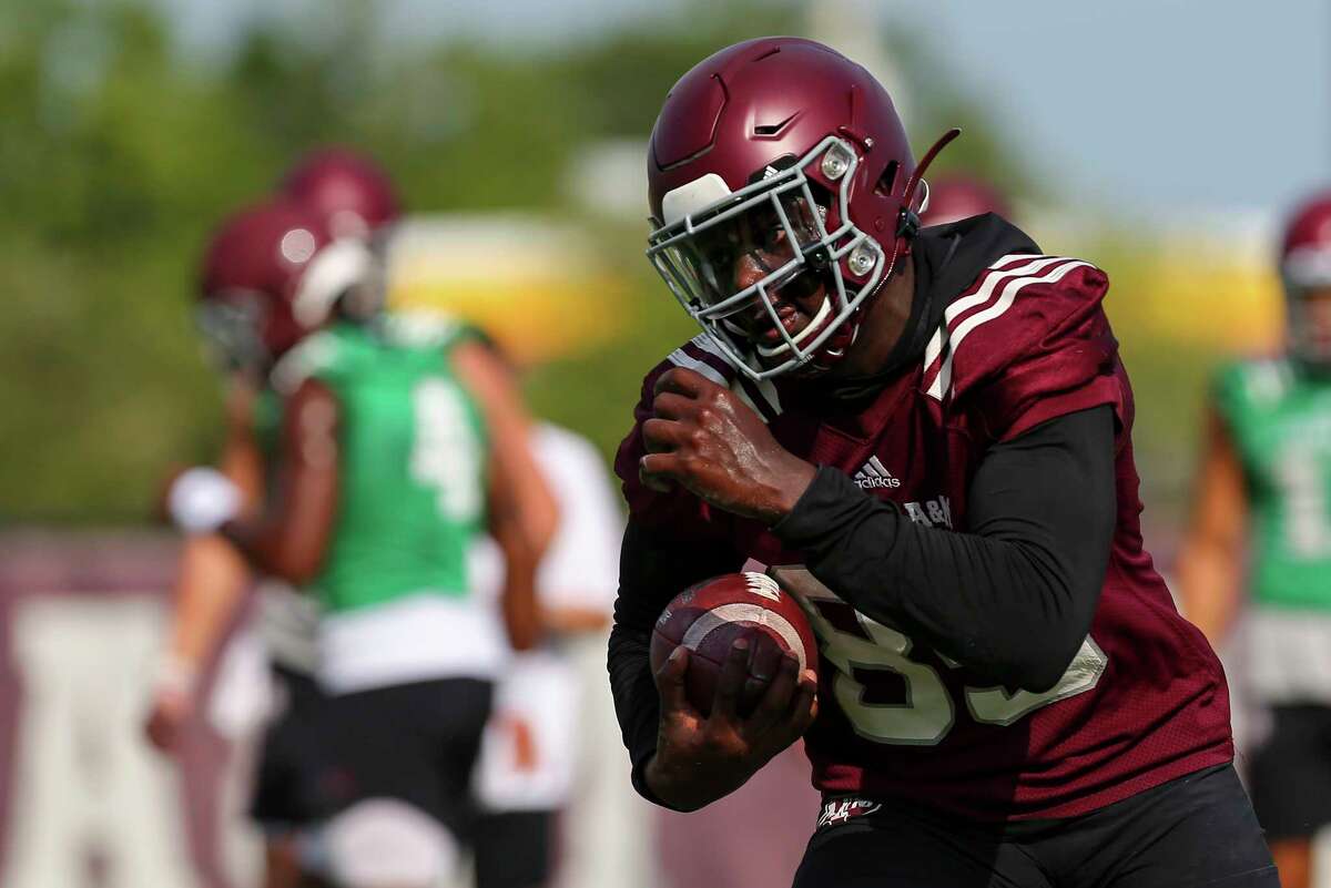 Texas A&M Aggies tight end Jalen Wydermyer (85) runs after catching the ball during the team's first practice Thursday, Aug. 1, 2019, in College Station, Texas.