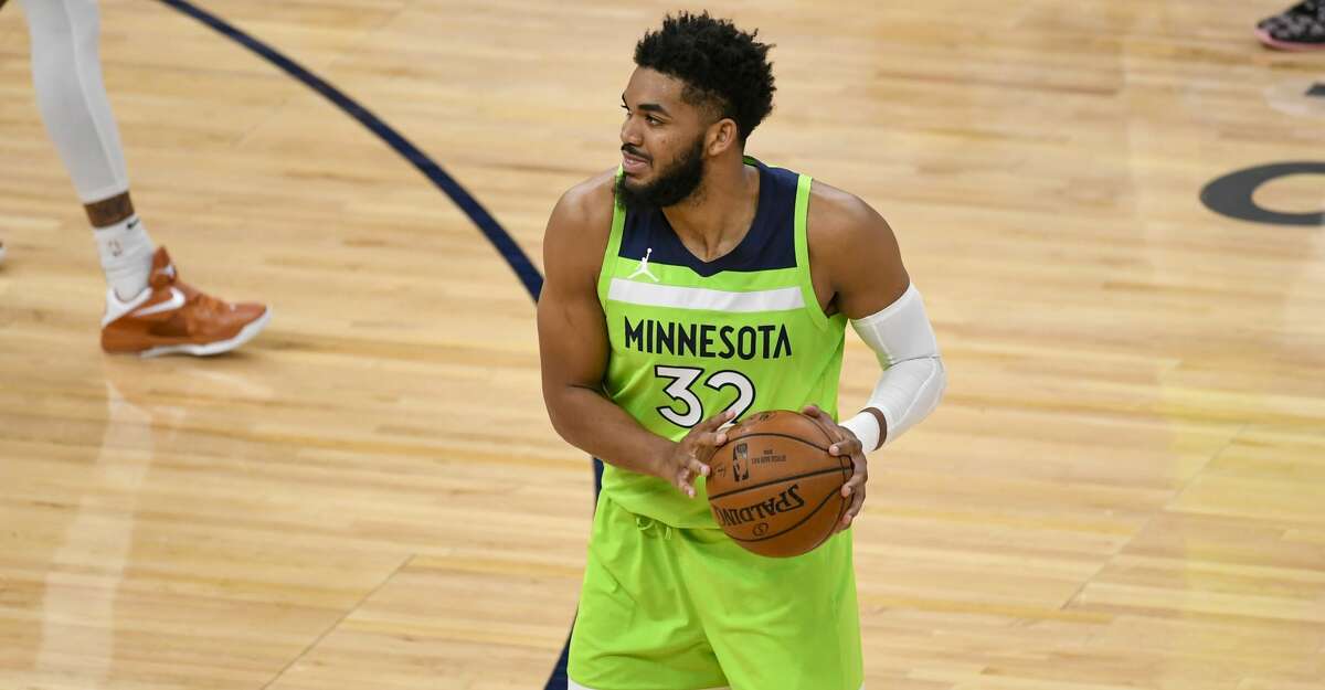 Minnesota Timberwolves center Karl-Anthony Towns (32) in action against the Portland Trail Blazers during the first half of an NBA basketball game Saturday, March 13, 2021, in Minneapolis. Portland won 125-212. (AP Photo/Craig Lassig)