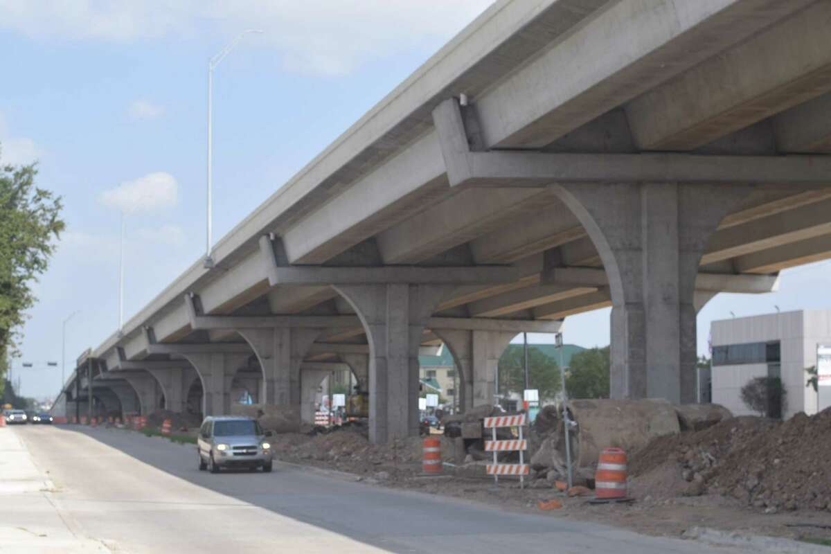 Construction crews are working on paving, signage, a raised center median and storm sewer installation on the under-construction FM 1960/Hwy. 6 bridge over U.S. 290.