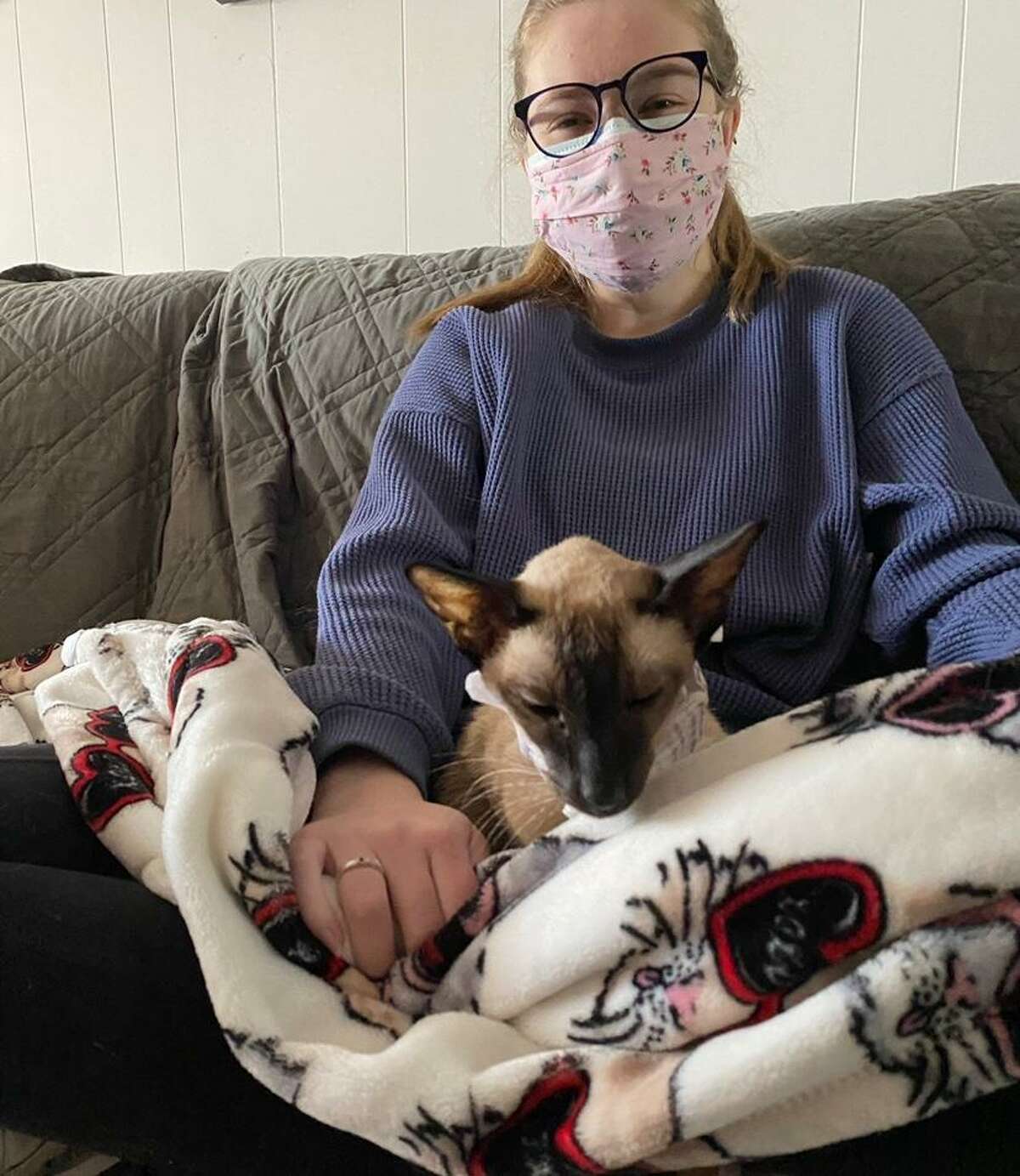 Ridgefield High School senior Maiki Muursepp snuggled up with Hudson, a rescue cat. She is also a member of Rock N’ Rescue’s junior advirory board.