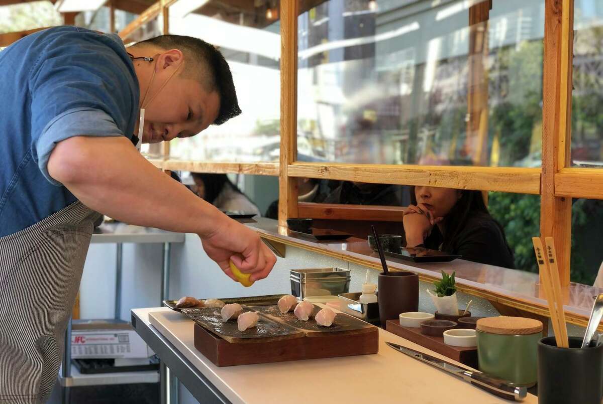 Executive chef Geoffrey Lee prepares sushi for a new all-outdoor omakase experience at Ju-Ni in San Francisco.