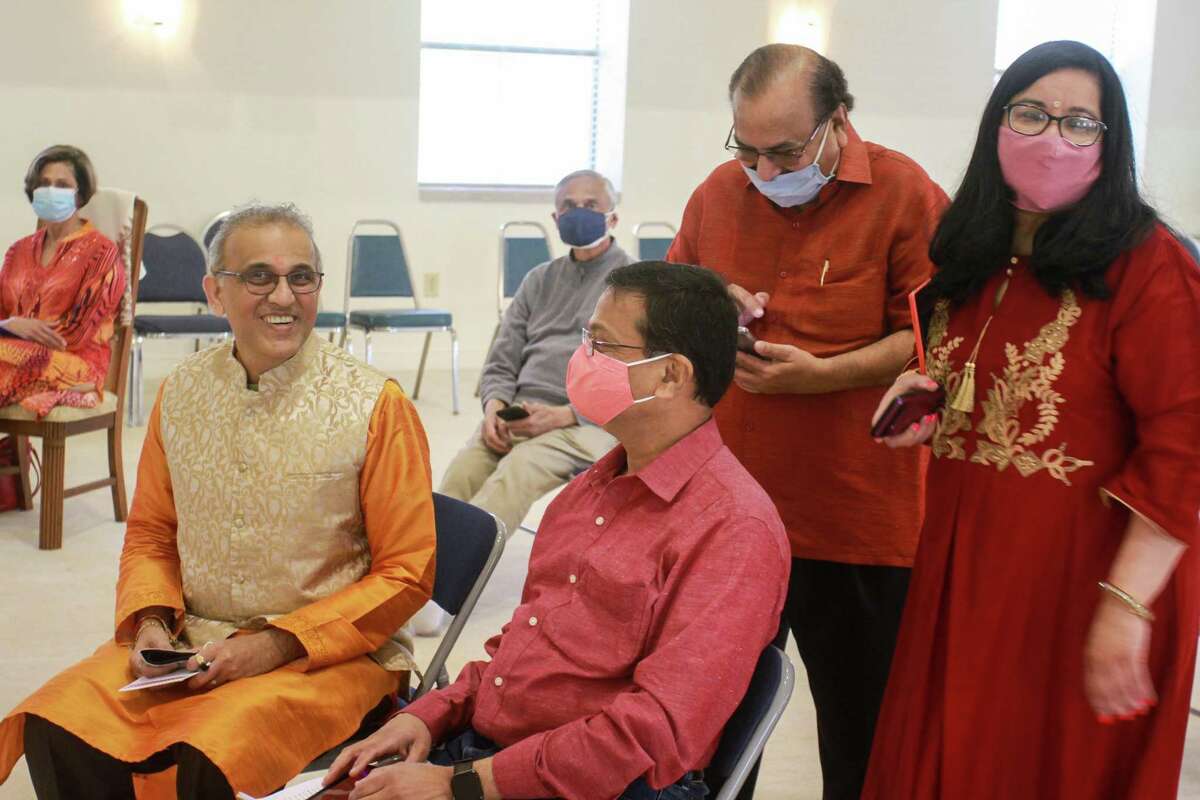 Swapan Dhairyawan, from left, Sanjay Sohoni, Prashant Munshaw and Nisha Mirani gather at Holi, which is celebrated differently this year. Instead of celebrating with flowers and colors, the JVB (Jain Vishwa Bharati) Preksha Center focused on the artistry of words for the holiday, inviting poets and writers to recite their works. This year, the center invited eight writers, and only 30 attendees, to limit attendance and follow social distancing protocol. They streamed the event to share with their usual audience. d the event to share with their usual audience.