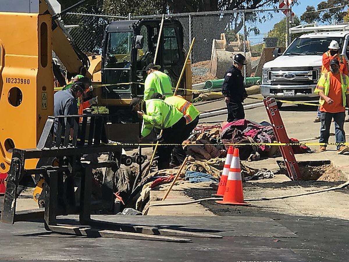 Workers rescuing people living in a 20-foot-long cave discovered under a Vallejo bridge on Friday, March 26 2021.