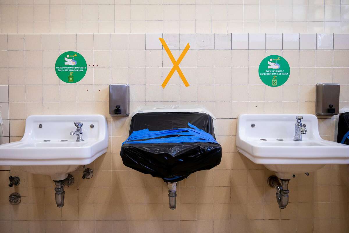 Every other bathroom sink is taped up to promote social distancing at Garfield Elementary School in Oakland.
