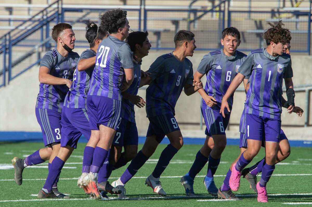 Midland High players celebrate after Freddy Lopez scores the first goal against El Paso Pebble Hills 03/26/21 during the Class 6A bi-district playoff game at Grande Communications Stadium. Tim Fischer/Reporter-Telegram