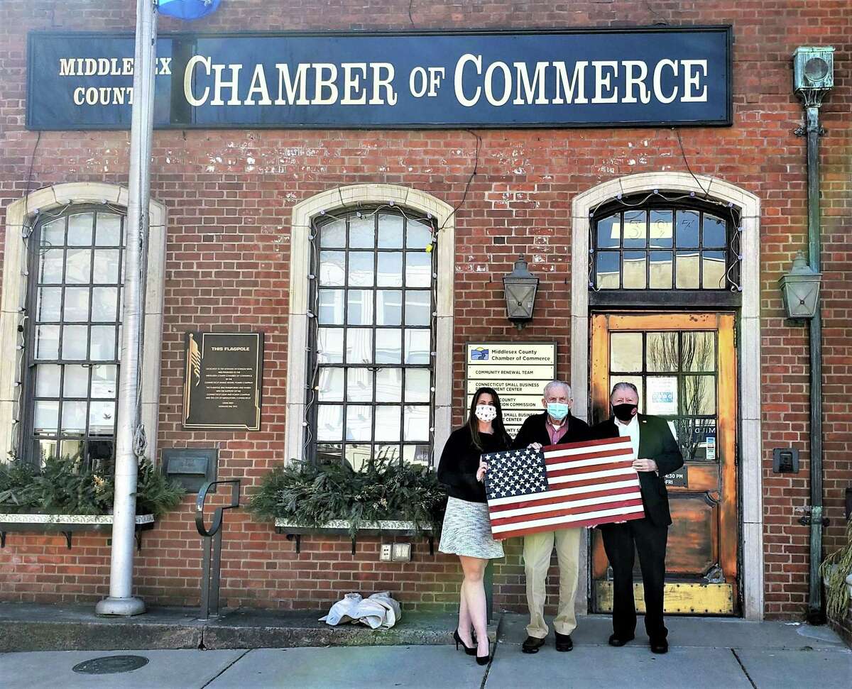 State Rep. Christie Carpino, R-Cromwell, gave a handmade wooden American flag to the Middlesex County Chamber of Commerce as a token of appreciation for all the organization does for the business community. From left are Carpino, Chamber President Larry McHugh and past chamber chairman Jay Polke.