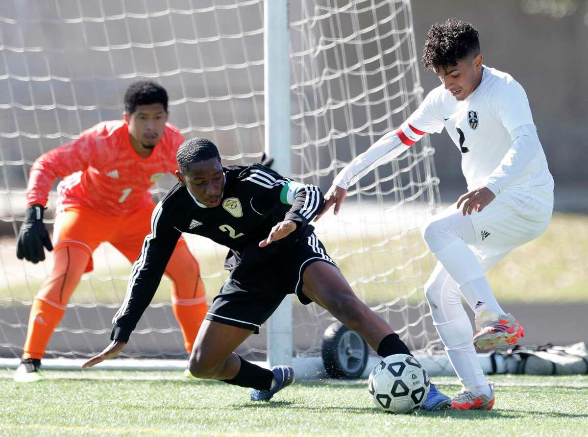 Conroe’s Carlos Salinas (2) works the ball against Sharpstown’s Jostin Garcia Lagos (2) as goalie Joalmo Cavezas (1) looks on in the first period of a match during the Kilt Cup soccer tournament, Saturday, Jan. 9, 2021, in Conroe.