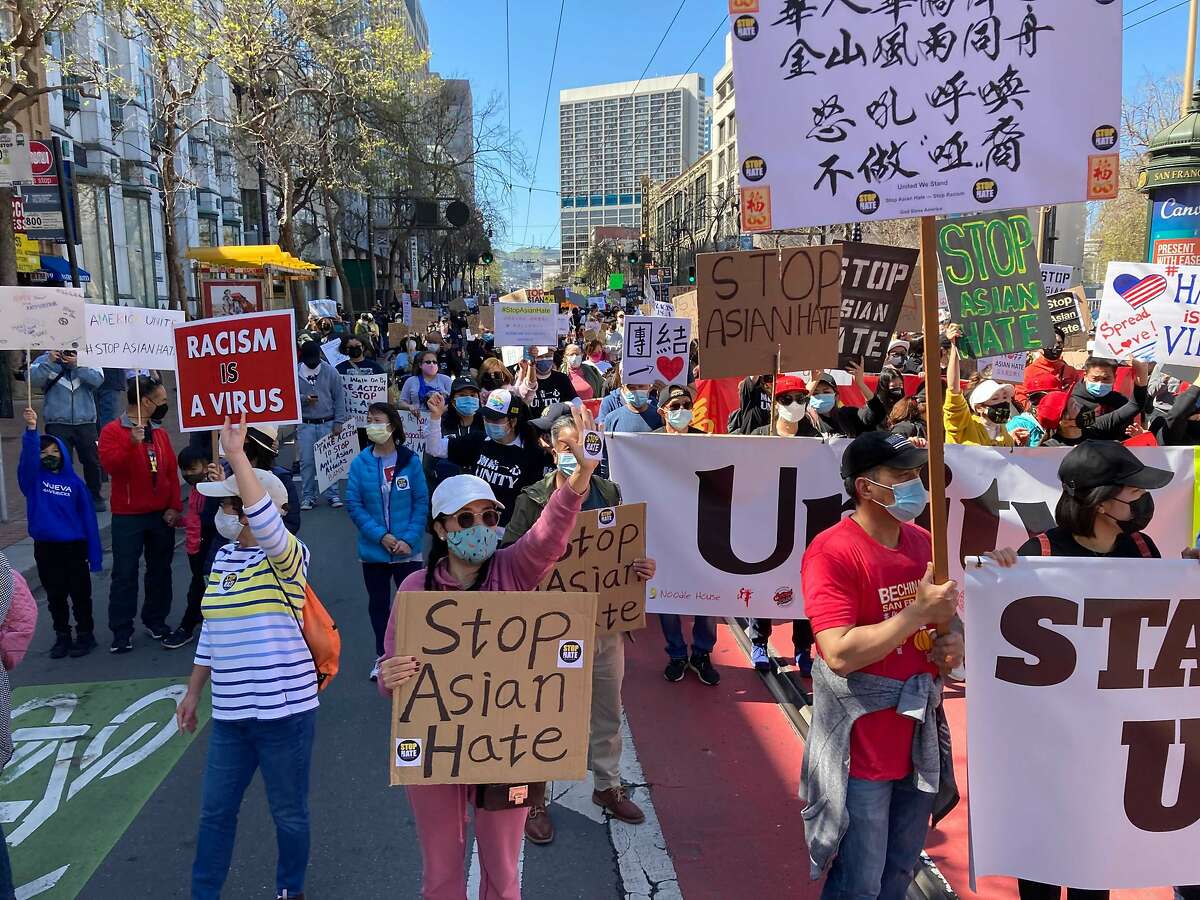 Demonstrators approach Sixth and Market streets in San Francisco during a national day of protest against anti-Asian violence. The crowd would eventually swell to 1,500.
