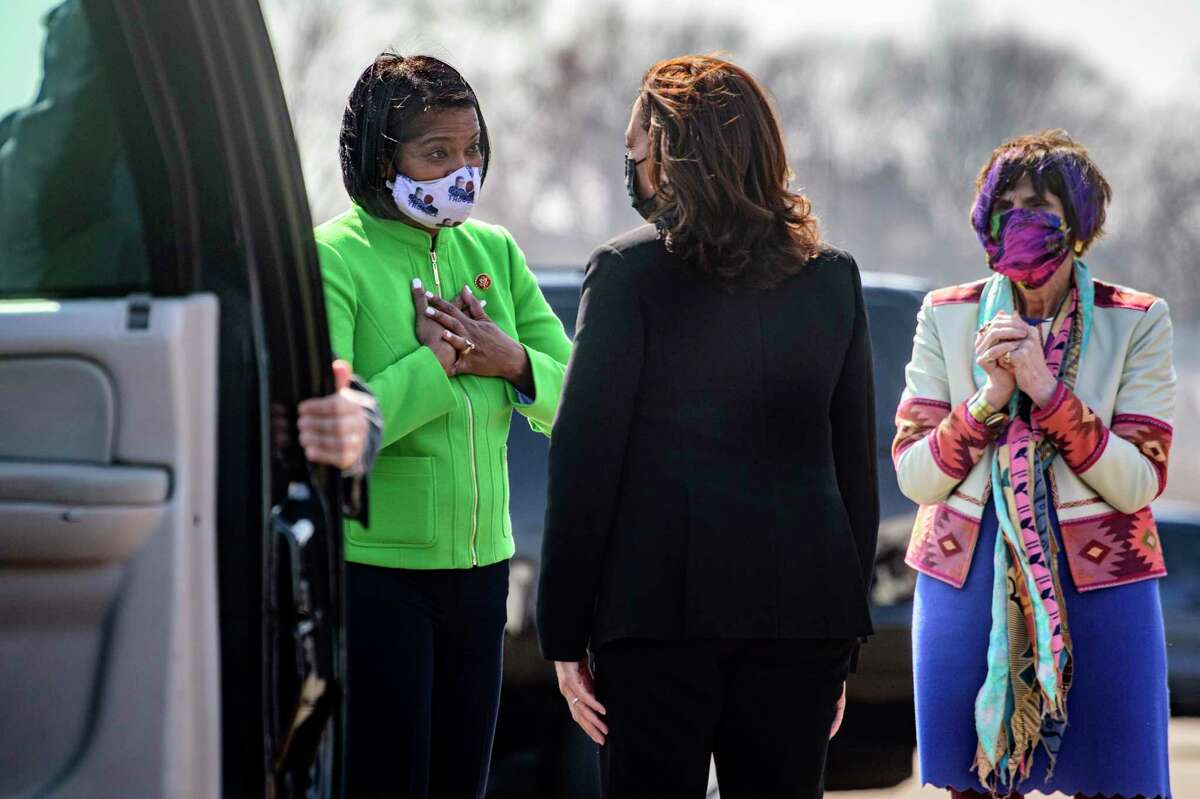 Vice President Kamala Harris greets U.S. Reps. Jahana Hayes, left, and Rosa DeLauro, D-Conn., she arrives at Tweed-New Haven Airport in New Haven, Conn., Friday, March 26, 2021. Mark Mirko/Hartford Courant via AP)