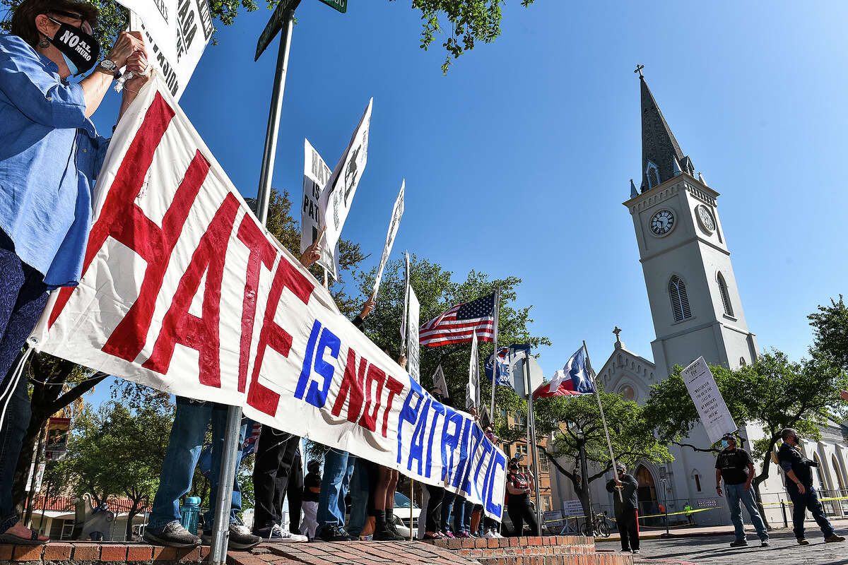 The No Border Wall Coalition and other activists gather near a meeting of the Republican Party of Texas in protest of rhetoric used when discussing immigration and border security, Friday, Mar. 26, 2021 at San Agustin Plaza