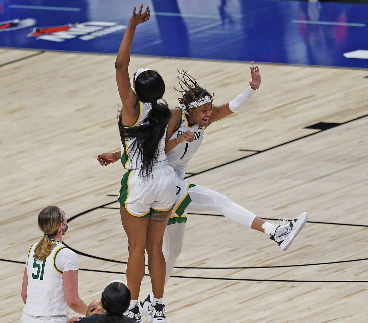 Baylor forward NaLyssa Smith (1) celebrates with Baylor center Queen Egbo (25) after Baylor defeated Michigan 78-75 in OT on Saturday, March 27, 2021 at the Alamodome.