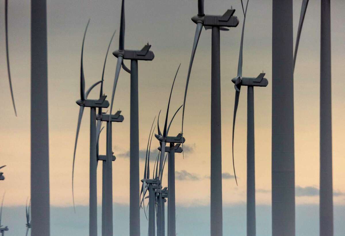 Wind turbines spin Tuesday, March 2, 2021 near Raymondville in the Rio Grande Valley in far south Texas.