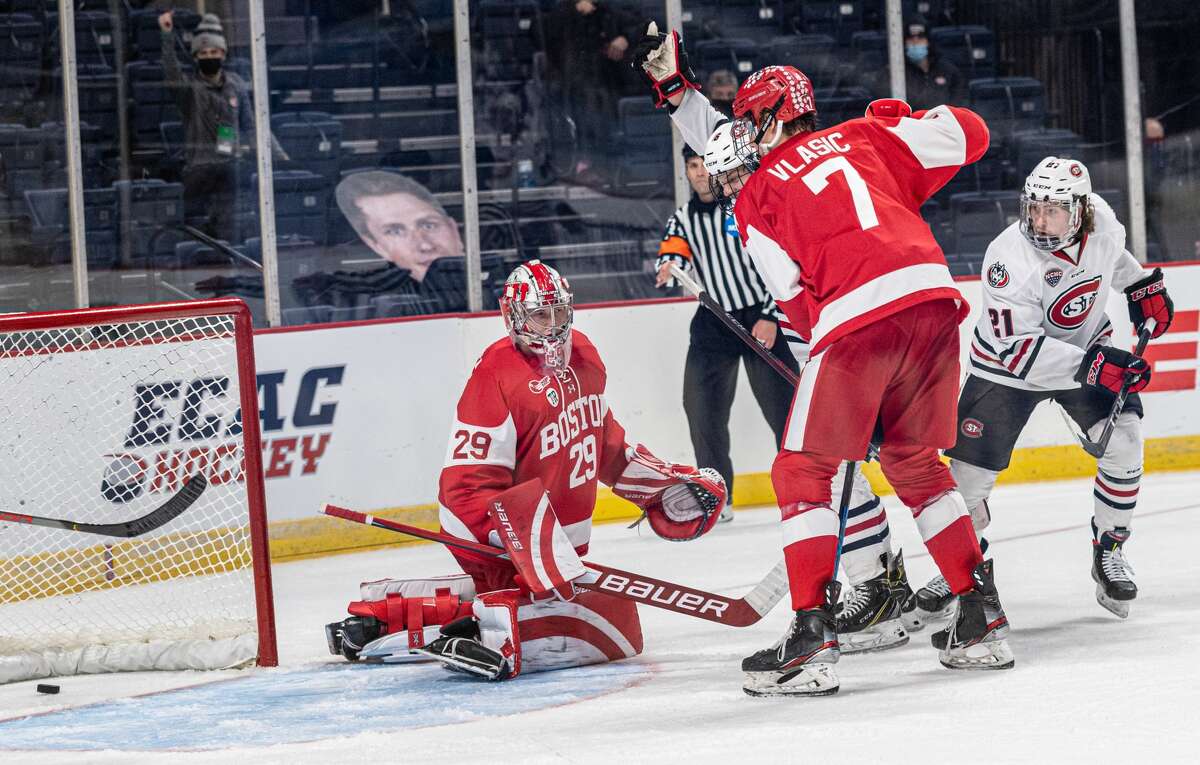 Boston University defenseman Alex Vlasic (7) and goaltender Drew Commesso look on helplessly as the puck enters the net in the second period of an NCAA hockey Albany Regional game at Times Union Center. A shot by St. Cloud State's Nick Perbix (not pictured) ricocheted off two BU players, including Vlasic, to give the Huskies a 2-1 lead. (Robert Simmons/Times Union Center)