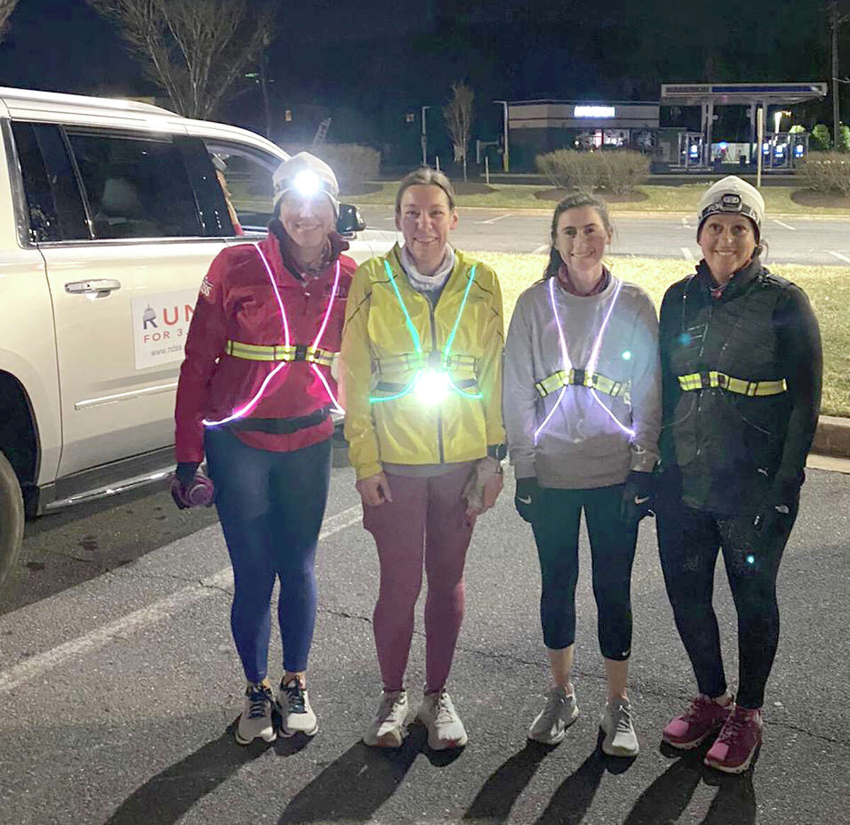 Jaime Durant of Albany, second from left, around 3:15 a.m. Sunday March 21 prior to running the 62nd leg of the National Down Syndrome Society's 260-mile relay from New York City to Washington D.C. Also pictured are teammates, from left, Meghan McGee, Gina Mannion and Misty Adams. (Provided)