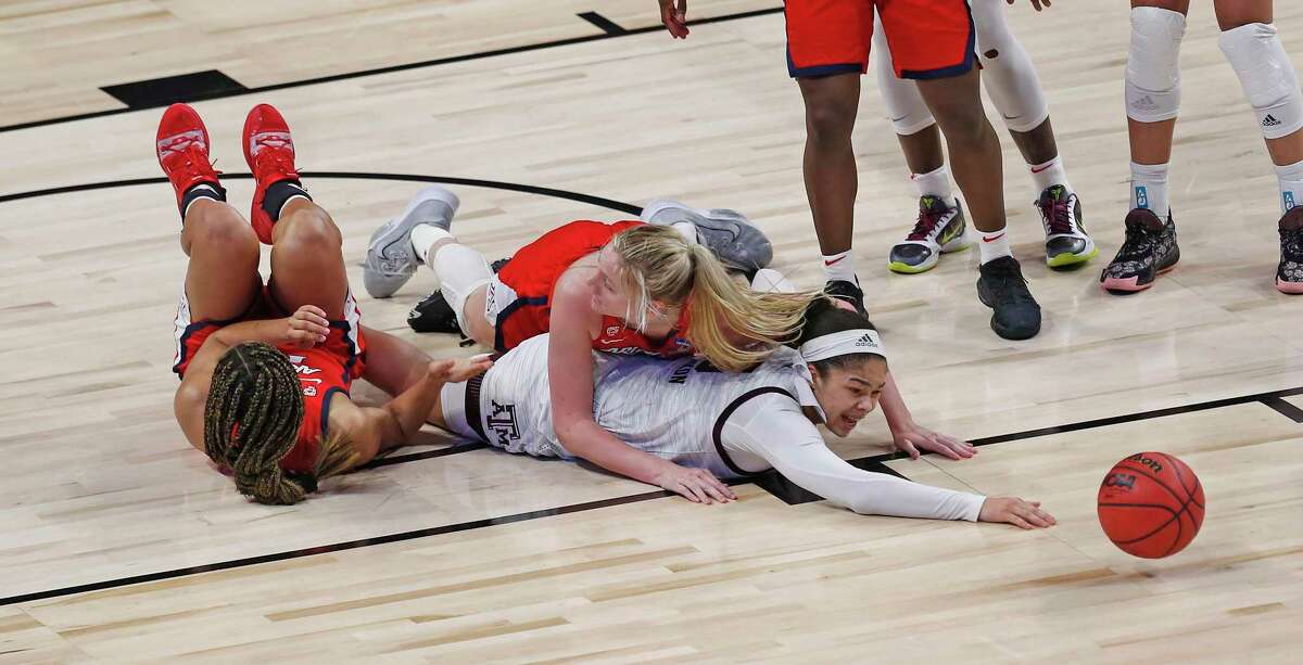 Texas A&M guard Jordan Nixon (5) reaches for a loose ball after being trapped by Arizona players in the second half on Saturday, March 27, 2021 at the Alamodome. Arizona defeated Texas A&M 74-59.