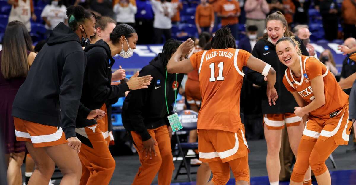 The Texas Longhorns celebrate their win over the Maryland Terrapins 64-61 in the Sweet Sixteen round of the NCAA Women's Basketball Tournament at the Alamodome on March 28, 2021 in San Antonio, Texas. (Photo by Carmen Mandato/Getty Images)