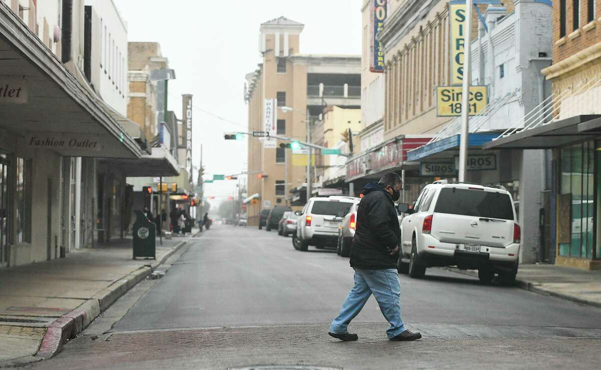 Shoppers bundle up as they walk through downtown Laredo, Thursday, Feb. 11, 2021. Laredo and the Rio Grande Valley are shaping up to be the epicenter of the state’s political universe in 2022.