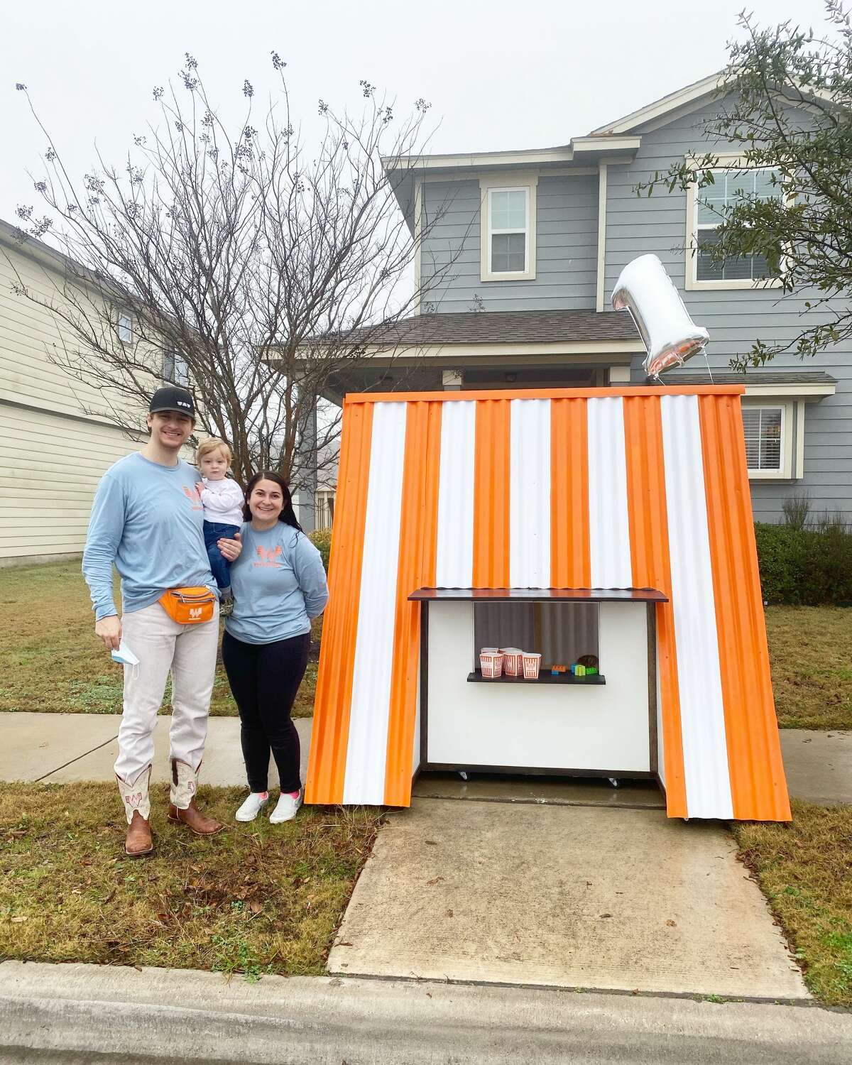 Danae and Ian Klingspor from Pflugerville (Northeast of Austin) build a more than 6-foot Whataburger playhouse for their baby's first birthday on Jan. 24.