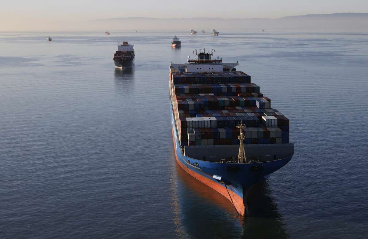 Container ships sit idle in the the San Francisco Bay just outside of the Port of Oakland on March 26, 2021 in San Francisco, California. 