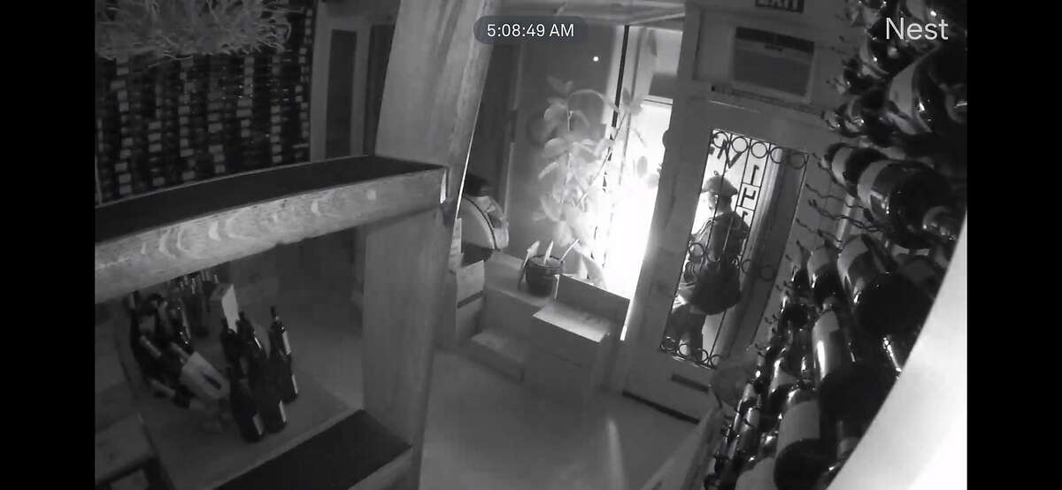 Security footage from Biondivino, a wine shop in S.F., shows a person attempting to break in on March 18, using a crowbar and a blowtorch.