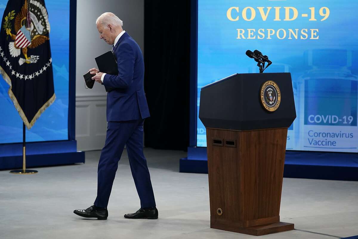 President Biden leaves after warning the U.S. could slip back and urging states that lifted mask mandates to restore them.
