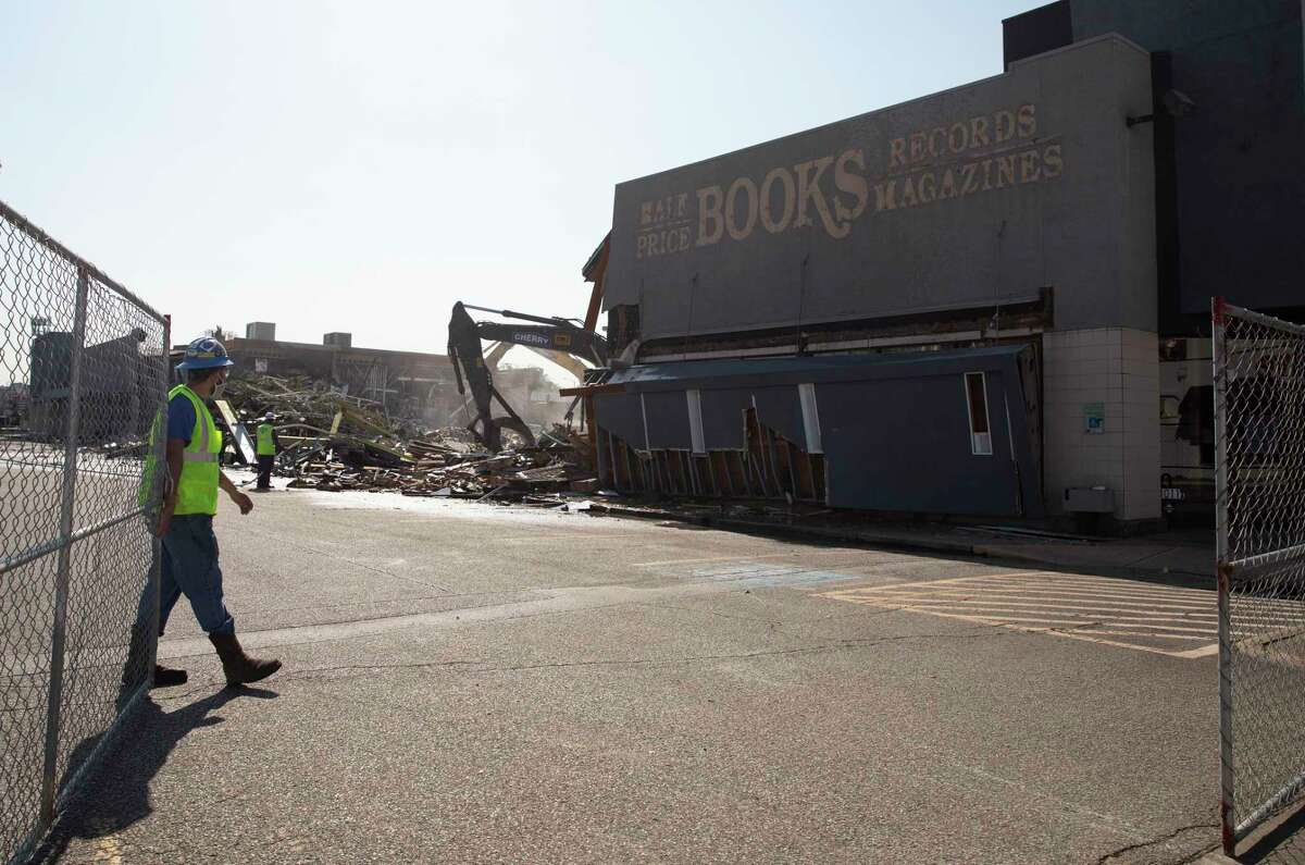 A crew razes the commercial building at the southwest corner of Montrose Boulevard and Westheimer in March.