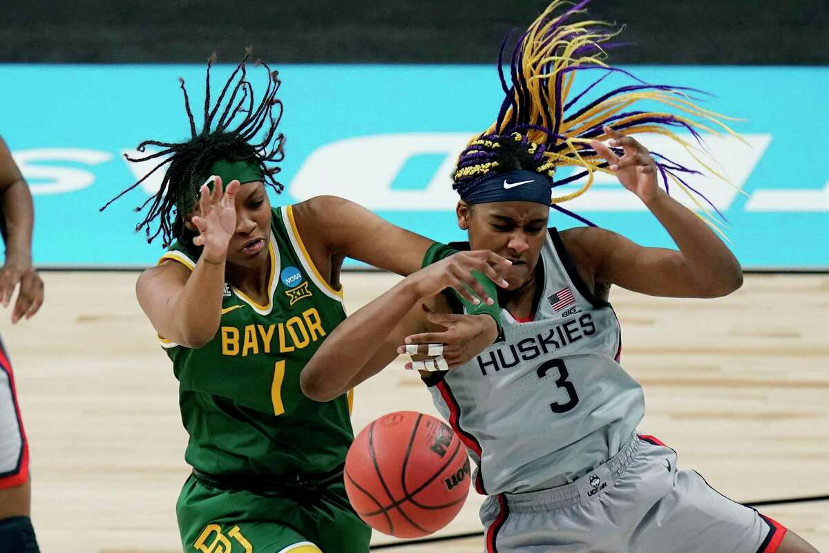 Baylor forward NaLyssa Smith (1) and UConn forward Aaliyah Edwards (3) battle for control of a rebound during the second half of a college basketball game in the Elite Eight round of the women's NCAA tournament at the Alamodome in San Antonio, Monday, March 29, 2021. (AP Photo/Eric Gay)