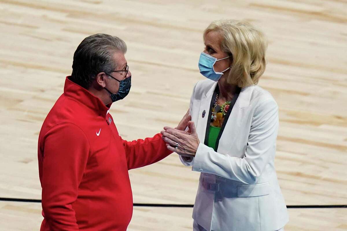 UConn head coach Geno Auriemma, left, and Baylor head coach Kim Mulkey, right, a college basketball game in the Elite Eight round of the women's NCAA tournament at the Alamodome in San Antonio, Monday, March 29, 2021. (AP Photo/Eric Gay)