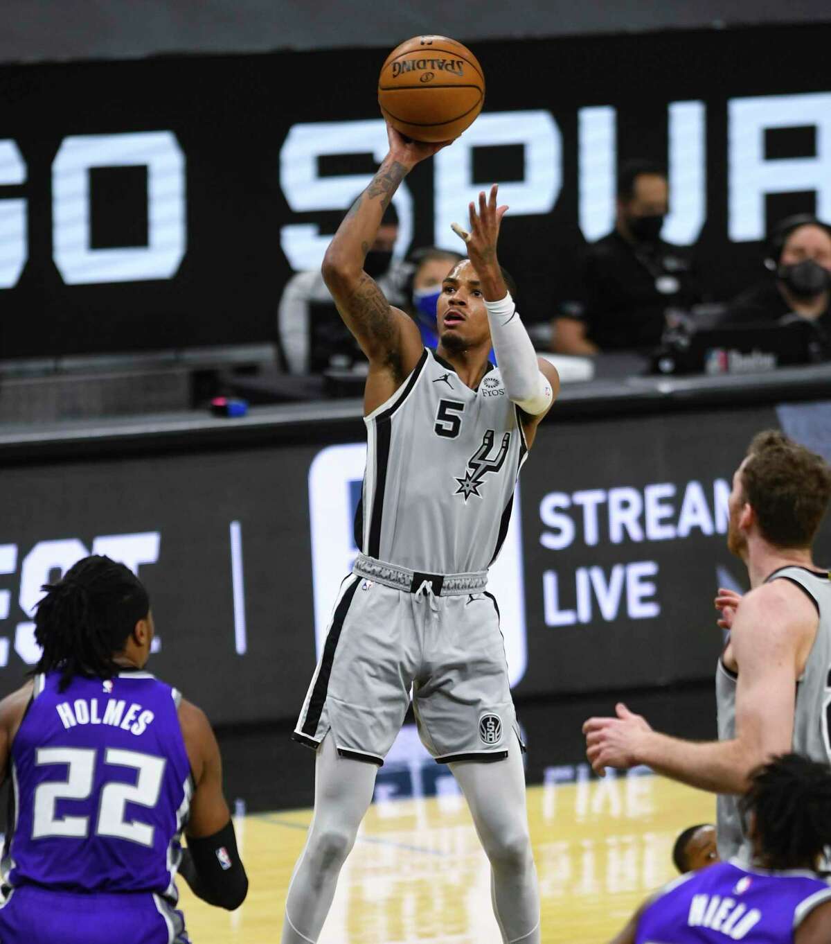 DeJounte Murray of the San Antonio Spurs shoots and scores against Sacramento during NBA action in the AT&T Center on Monday, March 29, 2021.